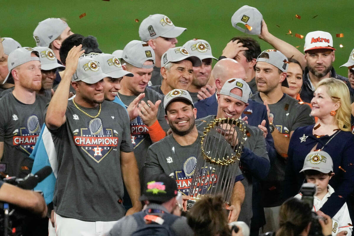 Houston Astros second baseman Jose Altuve holds the trophy after their 4-1 World Series win against the Philadelphia Phillies in Game 6 on Saturday, Nov. 5, 2022, in Houston. (AP Photo/Sue Ogrocki)