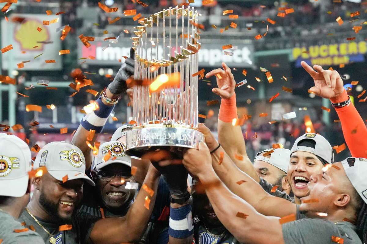 The Houston Astros raise the World Series trophy after their 4-1 win over the Philadelphia Phillies at Minute Maid Park on Saturday, Nov. 5, 2022, in Houston.