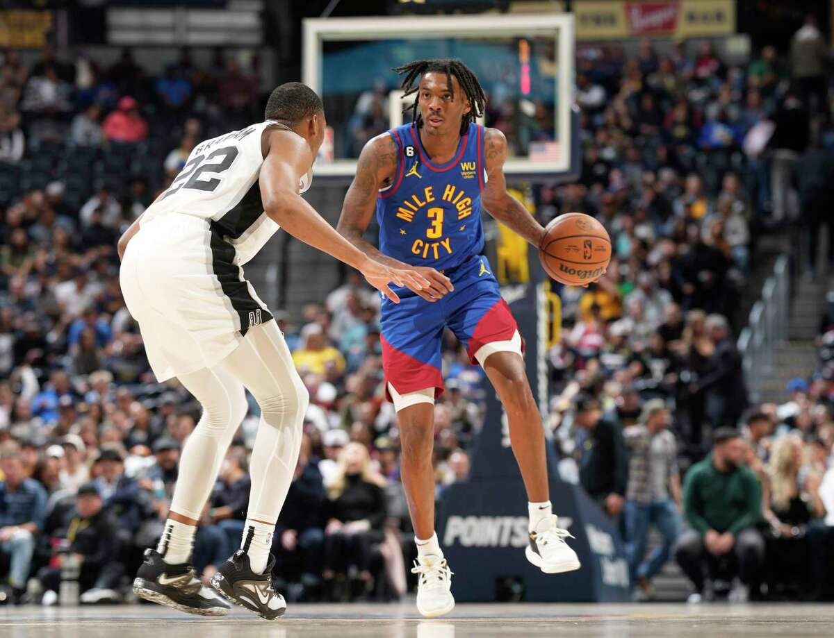 Nuggets guard Bones Hyland, right, put on quite a display against Malaki Branham and the Spurs on Saturday in Denver. The flashy guard, a late first-round pick in 2021, has emerged as a key piece in Denver’s offense this season.