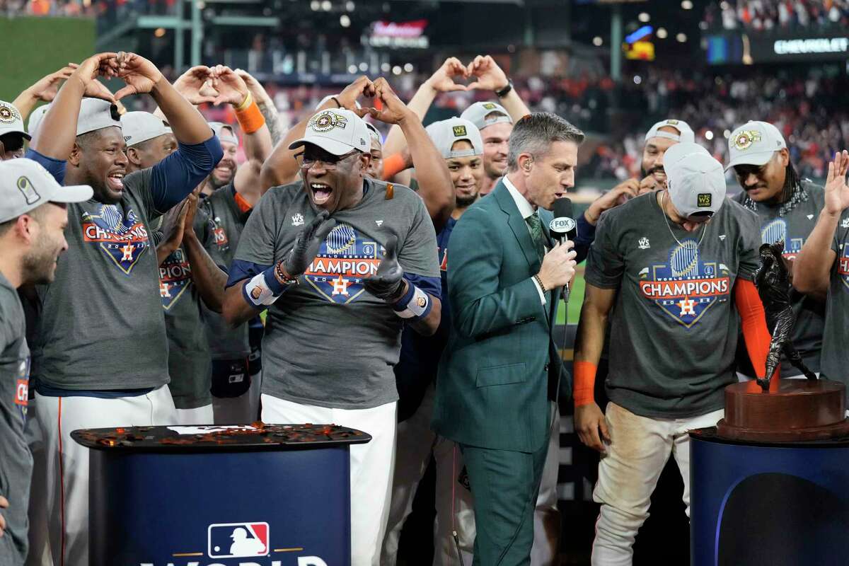 Houston Astros manager Dusty Baker Jr. claps as players make a heart with their hands as shortstop Jeremy Peña was named the MVP of the World Series at Minute Maid Park on Saturday, Nov. 5, 2022, in Houston.