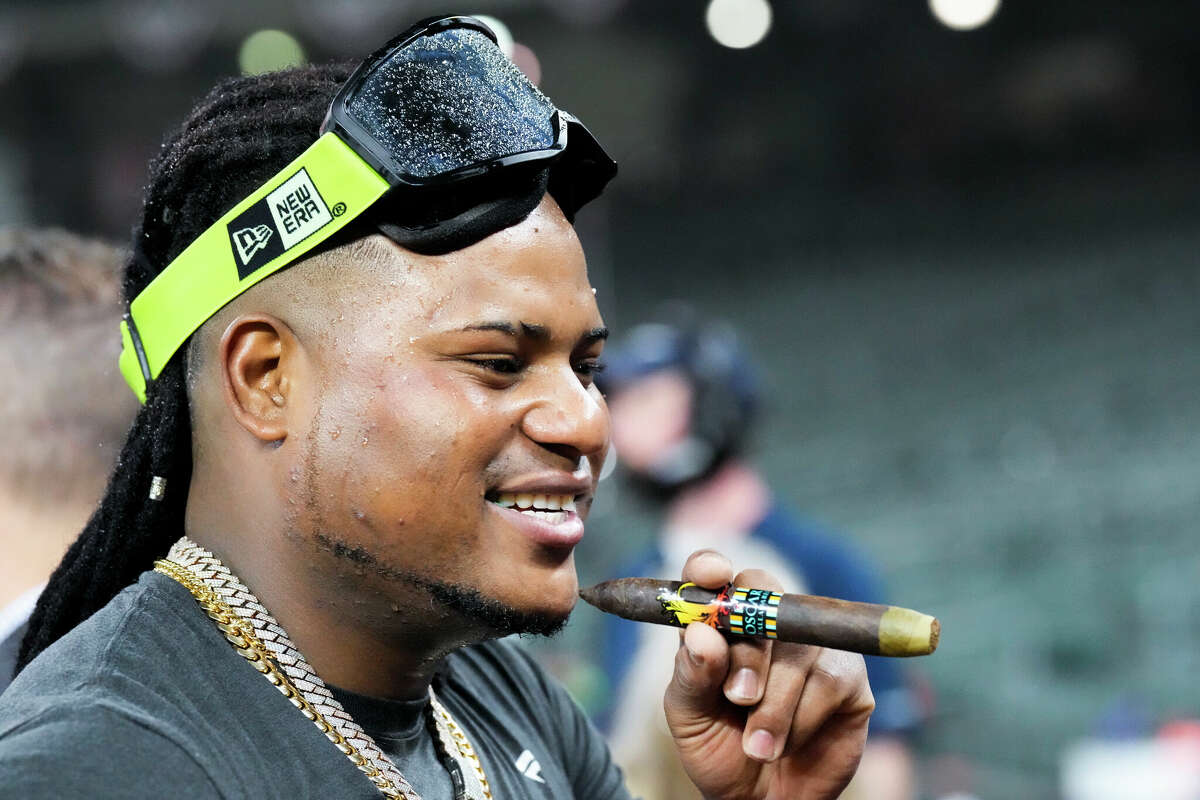 Houston starting pitcher Framber Valdez smokes a cigar after the Astros won the World Series over the Philadelphia Phillies at Minute Maid Park on Saturday, Nov. 5, 2022, in Houston.