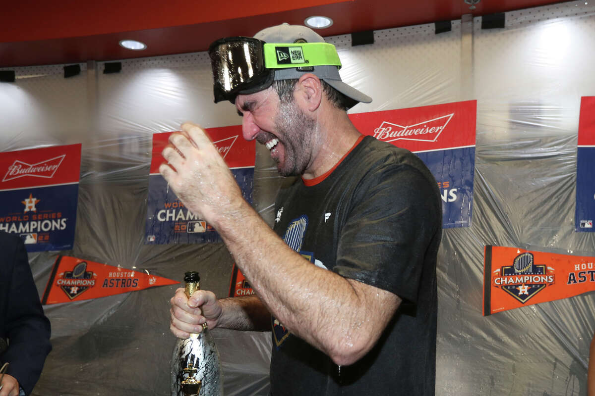 Houston Astros pitcher Justin Verlander celebrates in the clubhouse after winning the World Series over the Philadelphia Phillies at Minute Maid Park on Saturday, Nov. 5, 2022, in Houston.