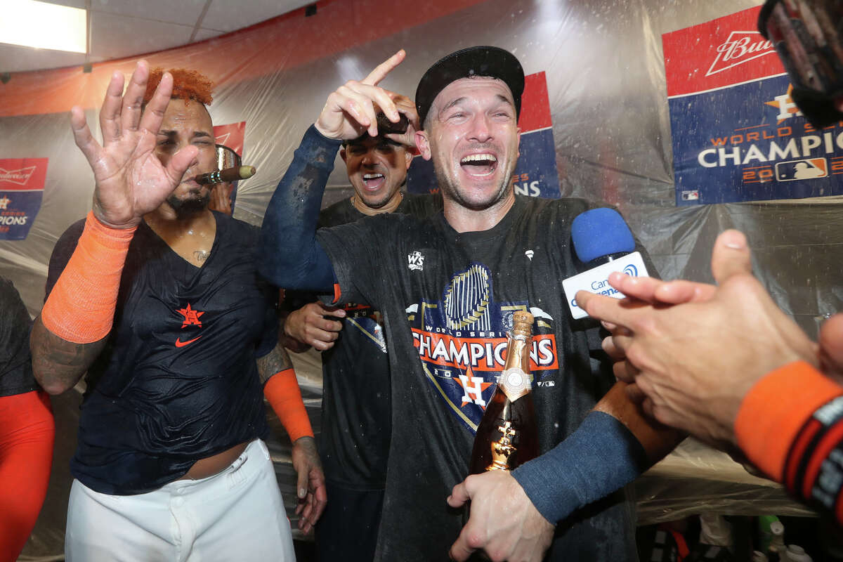 Houston Astros Alex Bregman, center, celebrates in the clubhouse after winning the World Series over the Philadelphia Phillies at Minute Maid Park on Saturday, Nov. 5, 2022, in Houston.