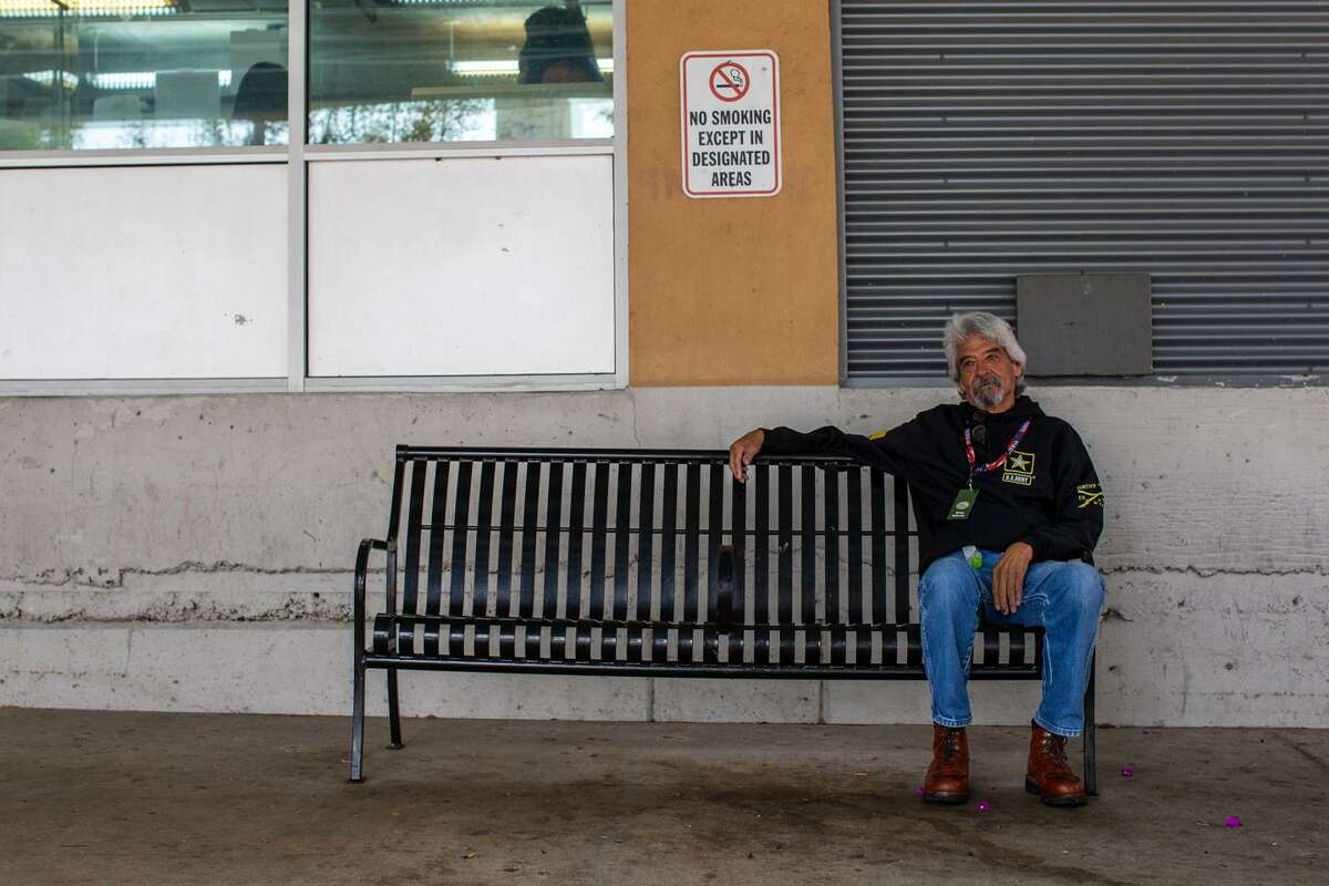 Armando Aguilar, 72, sits on a bench he fondly refers to as his “office” outside the main Haven for Hope office in downtown San Antonio on Friday. Aguilar is a Vietnam-era Army veteran who struggled after returning home to a country angry and opposed to the war for around 50 years before becoming homeless and seeking hope and internal healing.