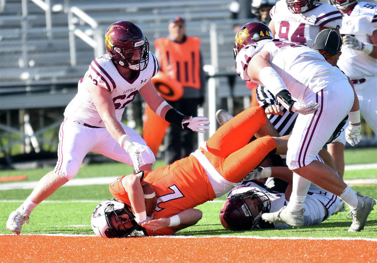 Edwardsville's Jake Curry is tackled short of the goal line against Loyola Academy in the second round of the Class 8A postseason inside the District 7 Sports Complex.