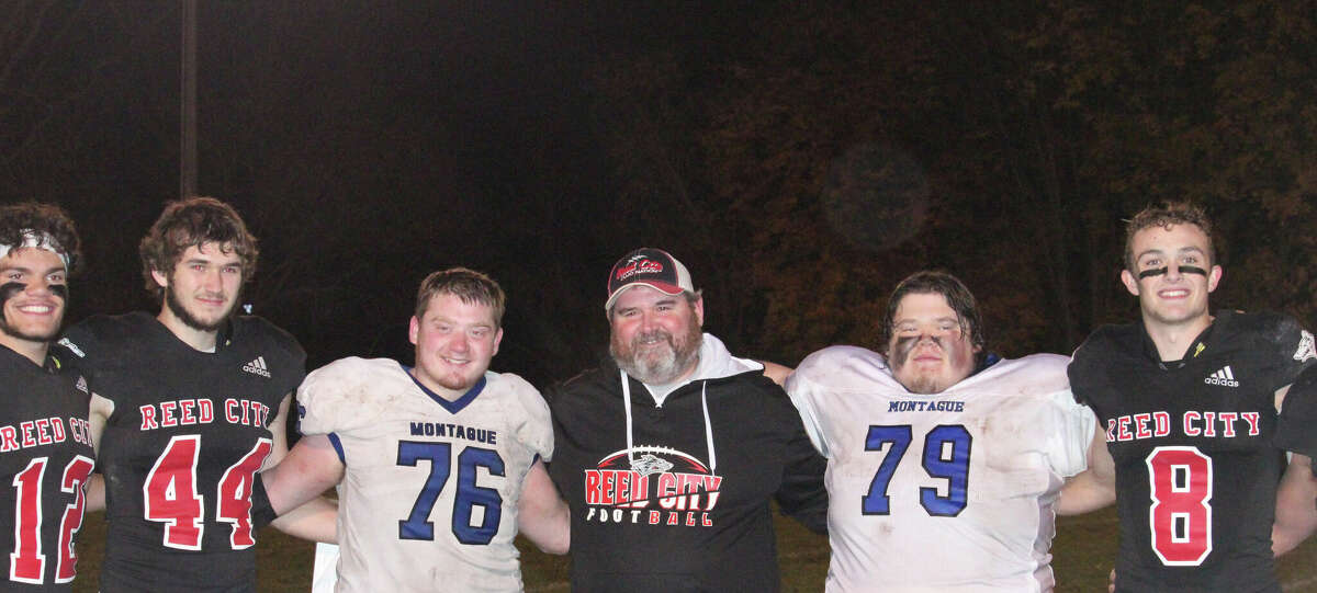 Former Reed City ball boys Dylan Powers (76) and his twin brother Owen (79) of Montague were reunited during the football playoff season with the Coyotes when the two teams played each other. Coach Scott Shankel (center) is pictured with players Xavier Allen (12), Teddy Szymanski (44) and Seth Jackson (8).