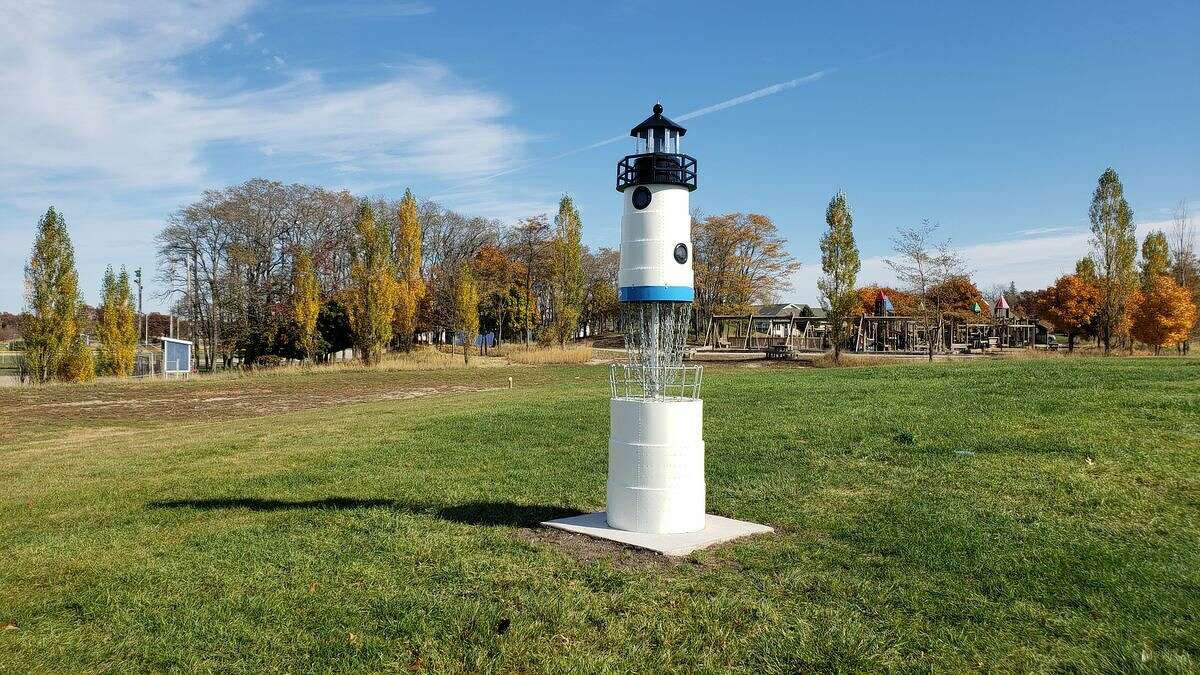 This custom-made replica of the Manistee North Pierhead Lighthouse was built by the Manistee Department of Public Works for a new disc golf course at Lighthouse Park. 