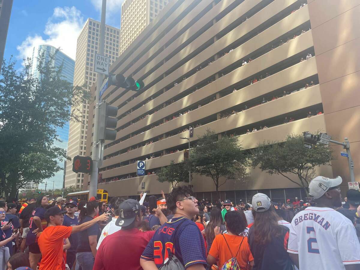 Parking garage hat toss on repeat at 2022 Astros World Series Parade