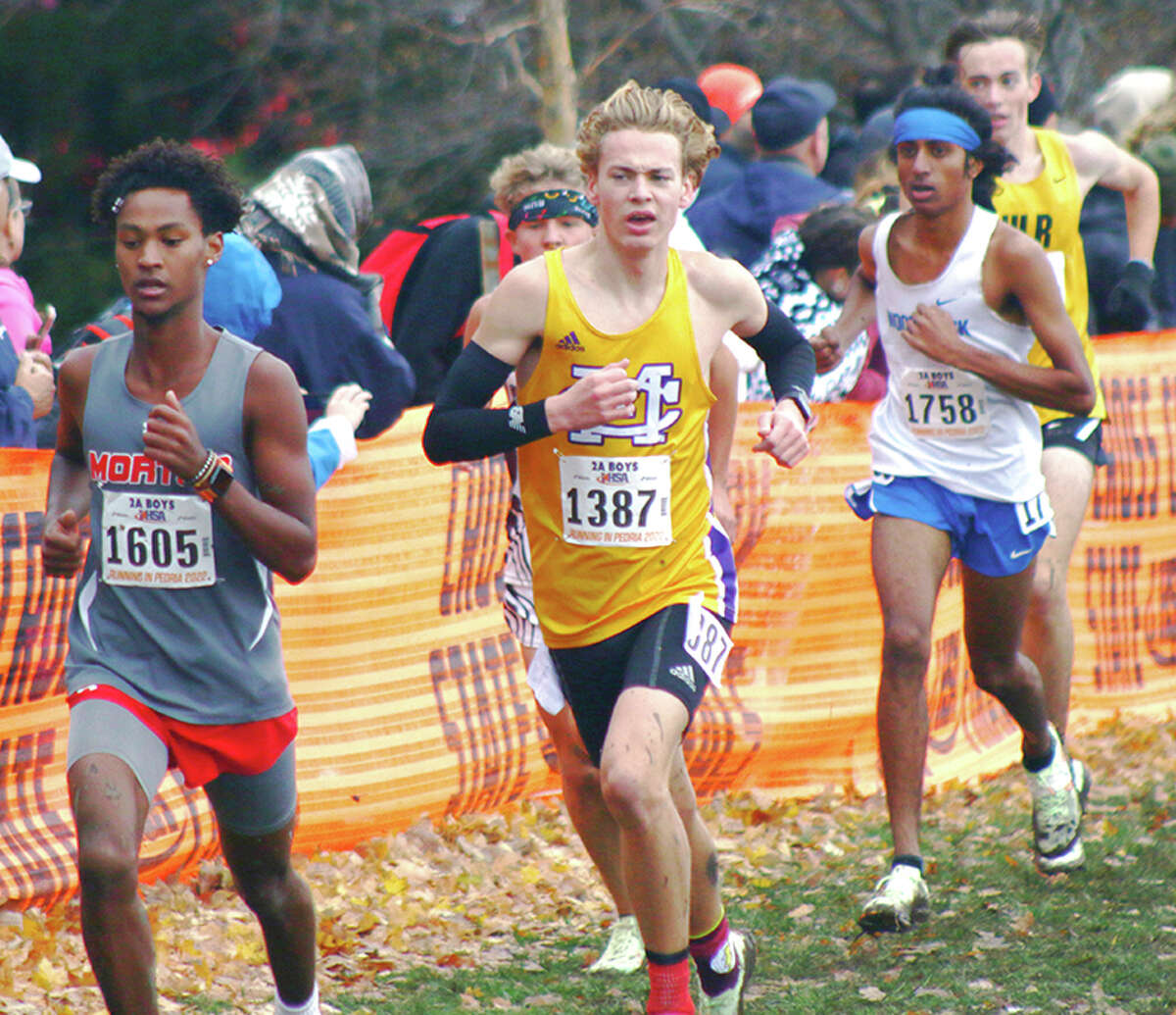 CM's Jackson Collman (middle) follows Morton's Yonas Wuthrich (left) during the Class 2A state cross country race at Detweiller Park in Peoria.