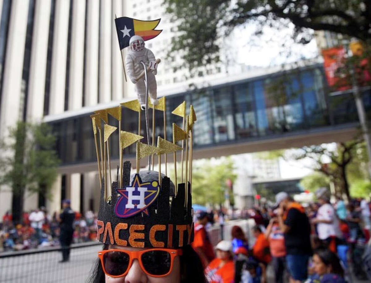 Beverly Gill from Baytown shows off her World Series hat she made while waiting for the Astros victory parade to start on Monday, Nov. 7, 2022 in Houston. Gill, who teaches fourth grade math and science had to call in sick today to make the parade.