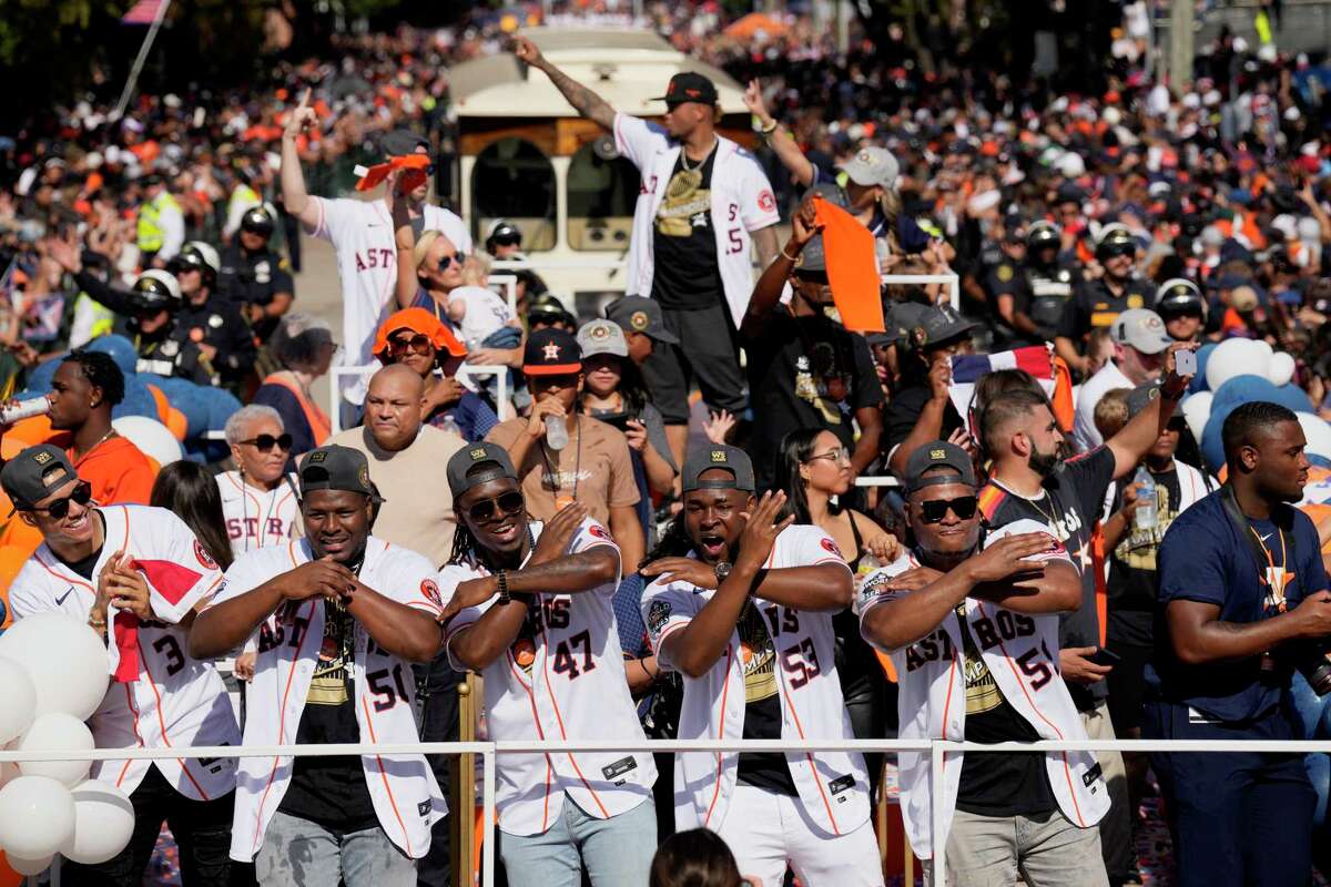 Members of the Houston Astros celebrate as the World Series parade makes it’s way down Smith S. On Monday, Nov. 7, 2022, in Houston.