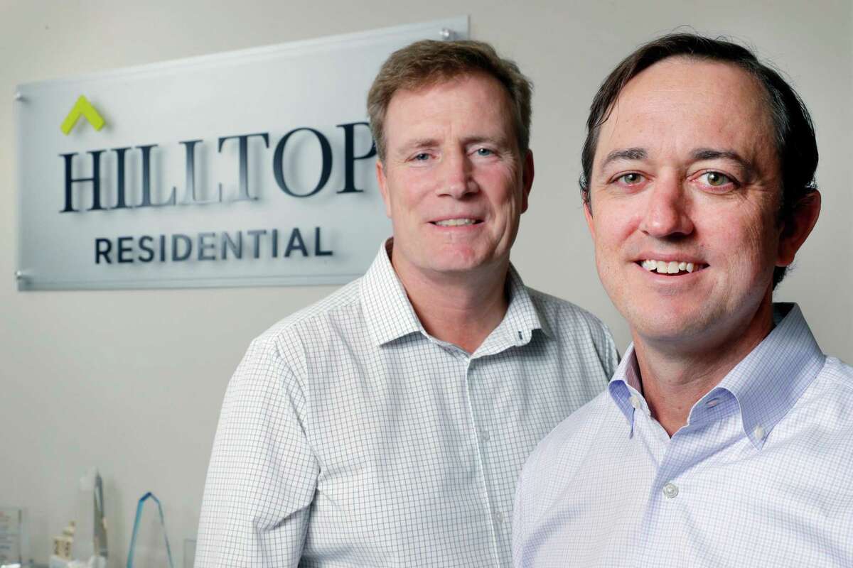 Hilltop Residential managing directors Greg Finch, left, and David Wylieat, right, in the lobby at their downtown offices in 9 Greenway Plaza Monday, Sept. 26, 2022 in Houston, TX.