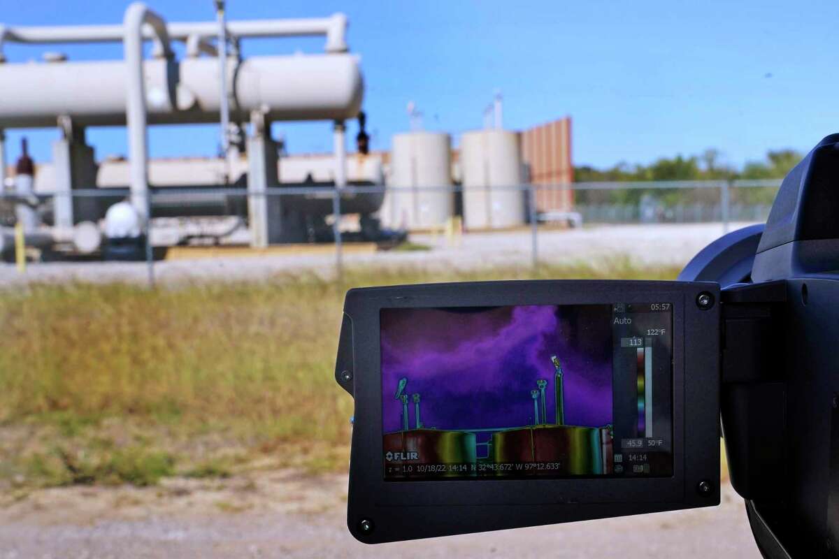 The screen on a thermal imaging camera shows methane leaking from tanks at a compressor station in Arlington, Texas, on Tuesday, Oct. 18, 2022. According to the International Energy Agency, methane is to blame for roughly 30% of the global warming that has occurred since the Industrial Revolution. (AP Photo/LM Otero)
