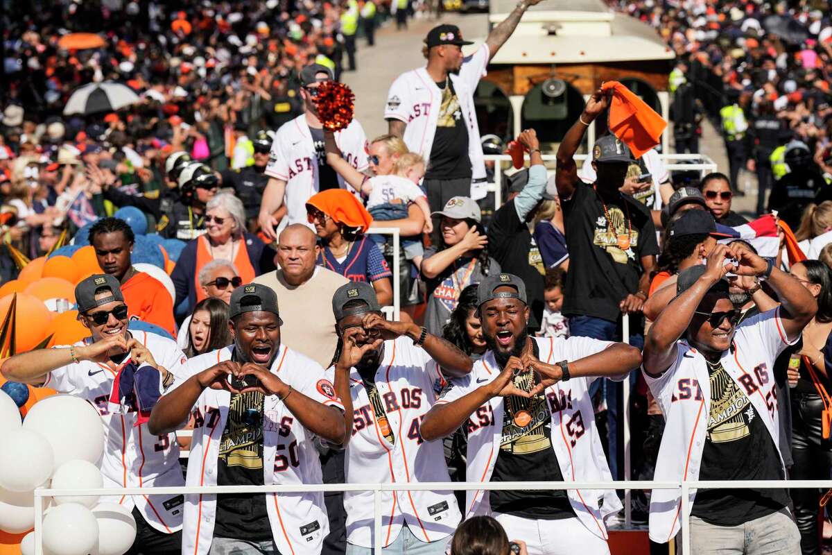 Astros players Jeremy Peña, from left, Hector Neris, Rafael Montero, Cristian Javier  and Framber Valdez flash the heart sign Peña popularized during this year's run to the championship.
