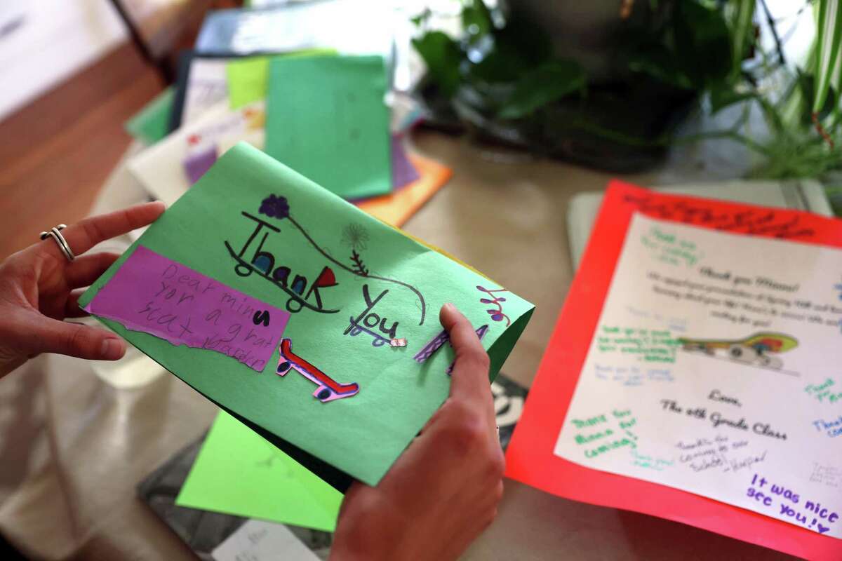 Minna Stess, a 16-year-old Olympic hopeful skateboarder, looks at a thank you note from a 3rd grader at The Spring Hill School that recently arrived at her home in Petaluma, Calif., on Tuesday, September 27, 2022.