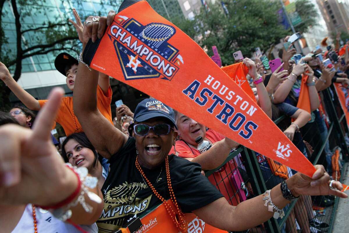 Houston Astros fans watch the 2022 World Series Championship Parade Monday, Nov. 7, 2022, in downtown Houston.