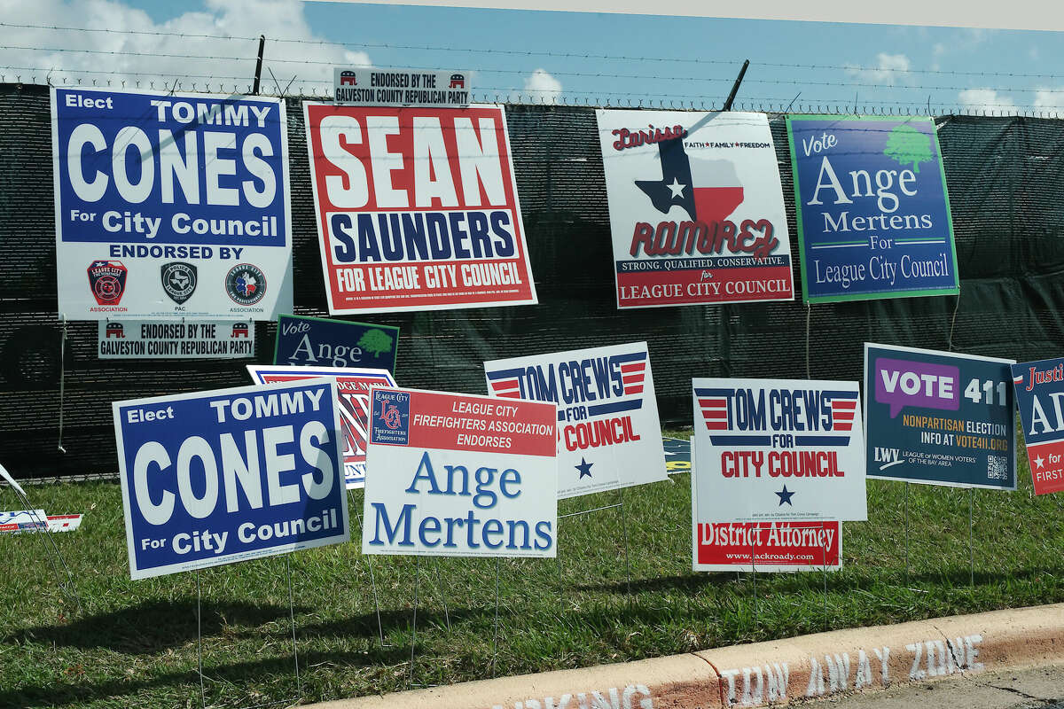 Campaign signs for candidates running for the League City City Council sit outside a polling location in League City.