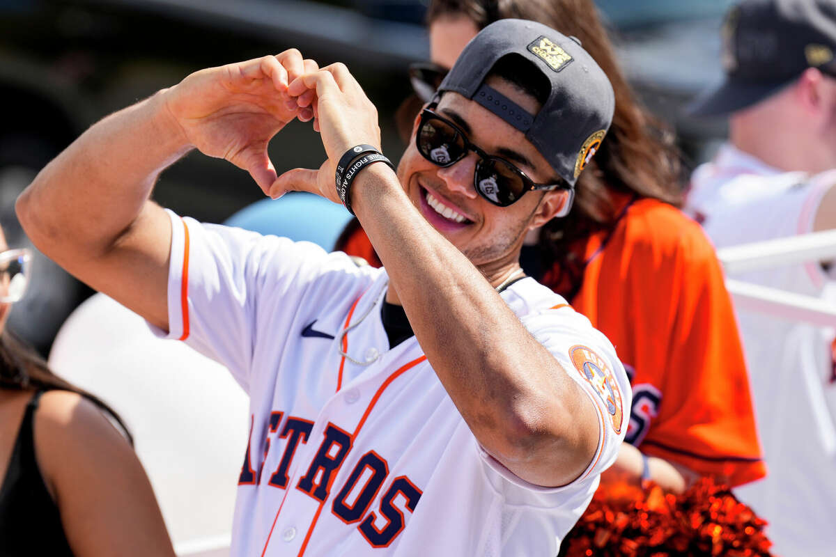 Houston Astros shortstop Jeremy Pena gestures with his heart sign during the Astros World Series championship parade on Monday, Nov. 7, 2022 in Houston.
