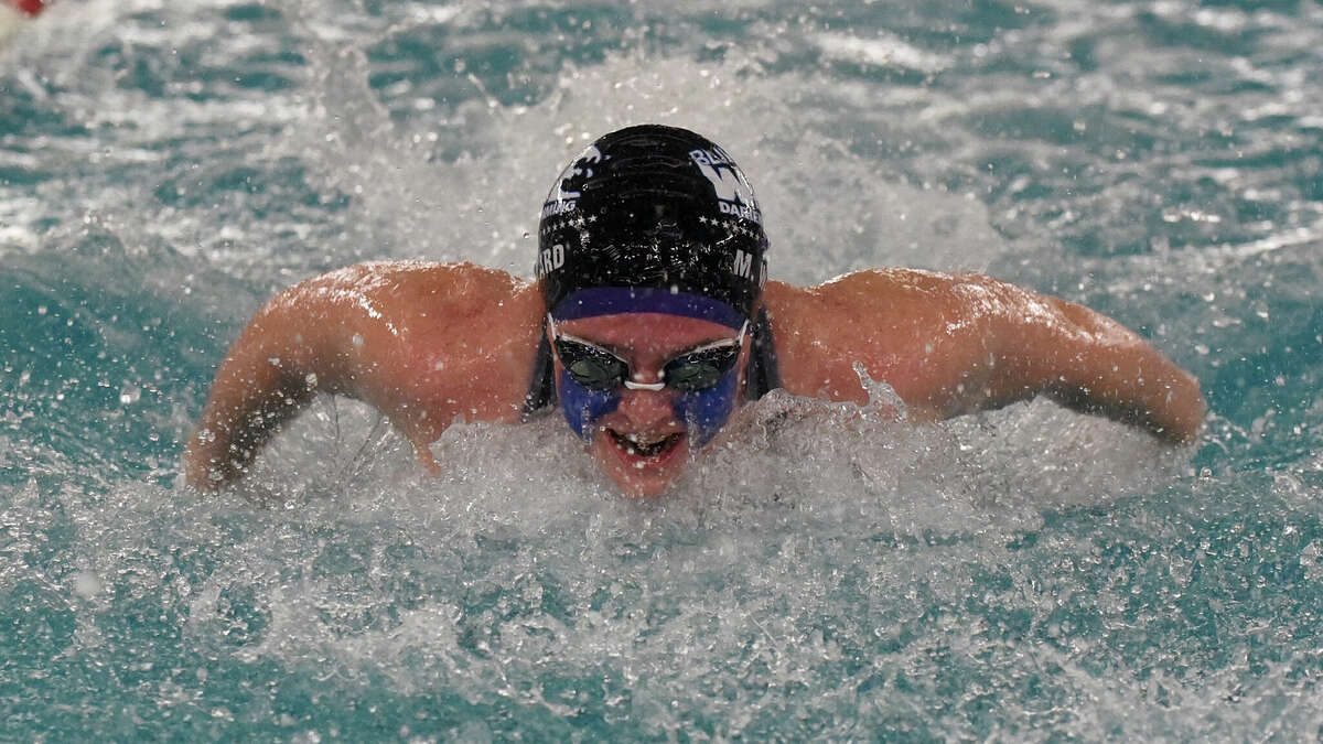 Darien's Miller Ward competes in the 200-yard individual medley during the FCIAC girls swimming finals in Greenwich on Friday, Nov. 4, 2022.