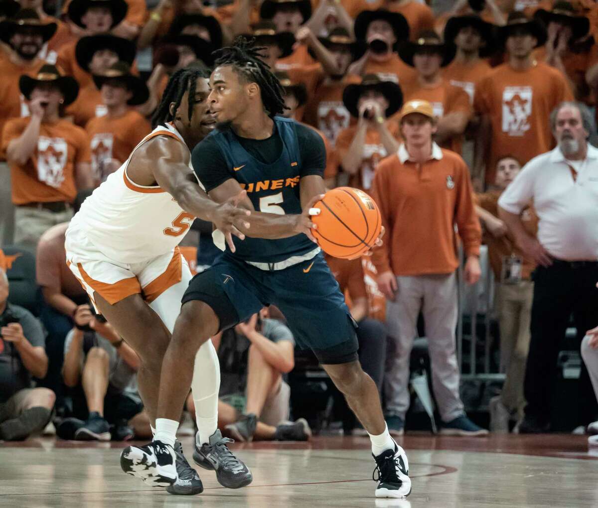UTEP guard Shamar Givance, right, is defended by Texas guard Marcus Carr, left, during the first half an NCAA college basketball game Monday, Nov. 7, 2022, in Austin, Texas. (AP Photo/Michael Thomas)