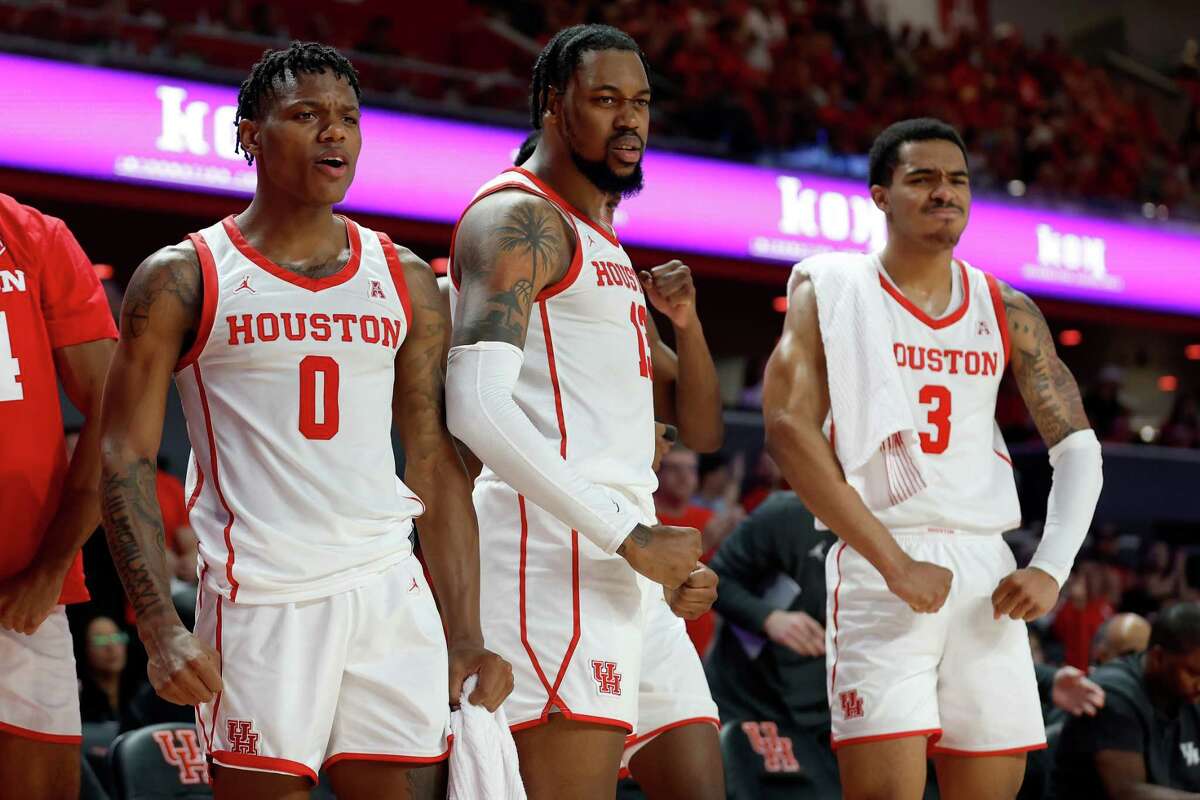 Houston Cougars guard Marcus Sasser (0), forward J'Wan Roberts (13), and guard Ramon Walker Jr. (3) react on the bench in the second half during the NCAA basketball game between the Houston Cougars and the Northern Colorado Bears at the Fertitta Center in Houston, TX on Monday, November 7, 2022.