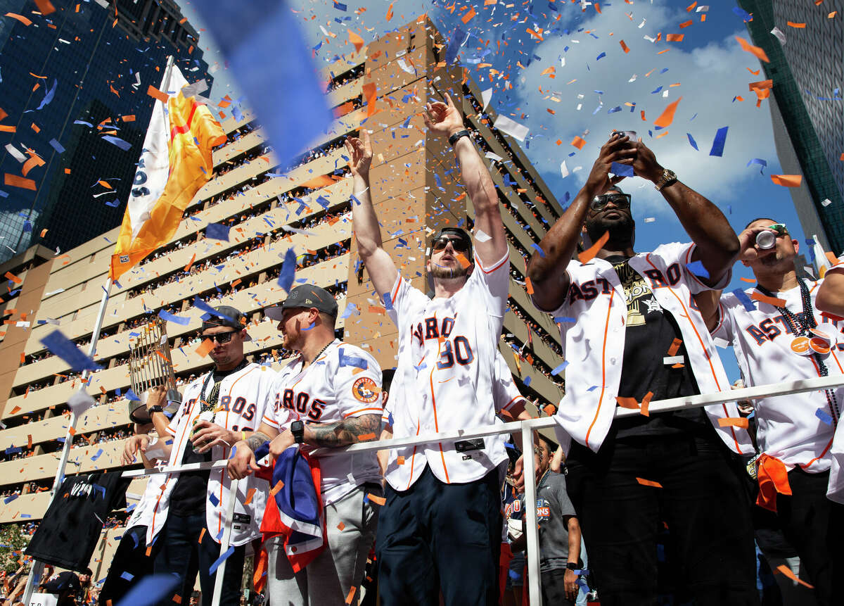 Houston Astros players Aledmys Diaz, from left, Christian Vazquez, Kyle Tucker and Yordan Alvarez wave at the crowd during the 2022 World Series Championship Parade Monday, Nov. 7, 2022, in downtown Houston.
