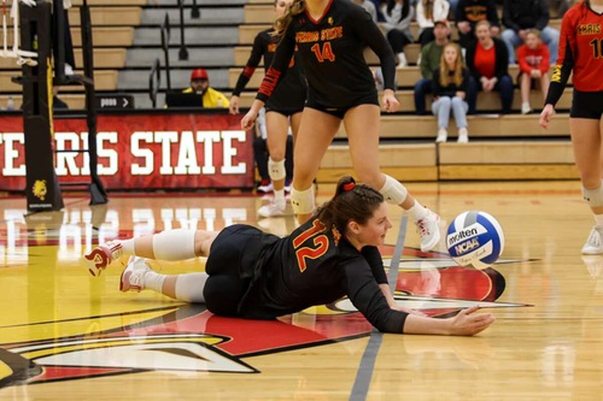Ferris' Kaylee Maat (12) dives for the ball on Saturday in a home match with Davenport.