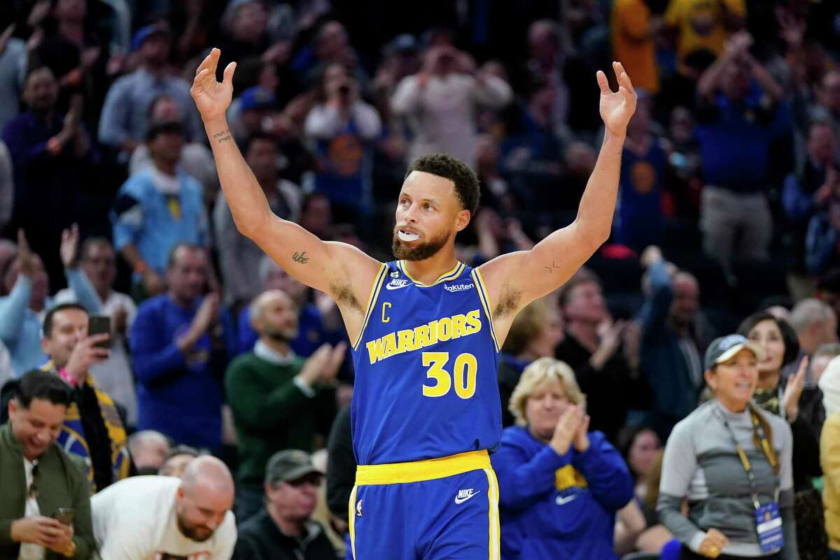 Golden State Warriors guard Stephen Curry (30) celebrates after shooting a 3-point basket against the Sacramento Kings during the second half of an NBA basketball game in San Francisco, Monday, Nov. 7, 2022. (AP Photo/Jeff Chiu)
