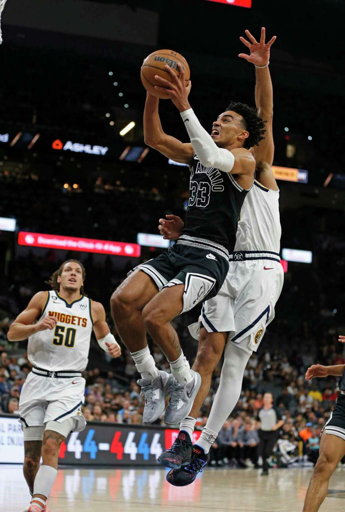 San Antonio Spurs Tre Jones #33 (33) drives for two against the Denver Nuggets in the first half on Monday, Nov. 7, 2022 at AT&T Center