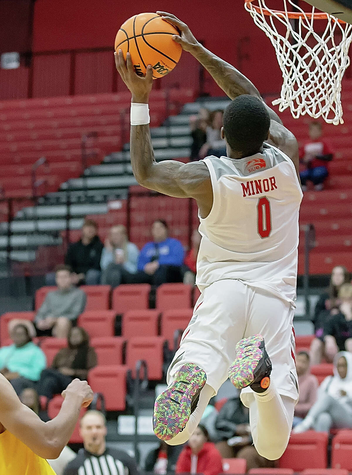 Damarco Minor of SIUE (0) goes up for a dunk against Harris-Stowe Monday night at  First Community Arena. 