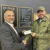 New Beginnings Fellowship Church in Reed City presented city council member Russ Nehmer with a donation of $6,470 toward the Veterans' Memorial Park project, proceeds from their recent fundraising events.