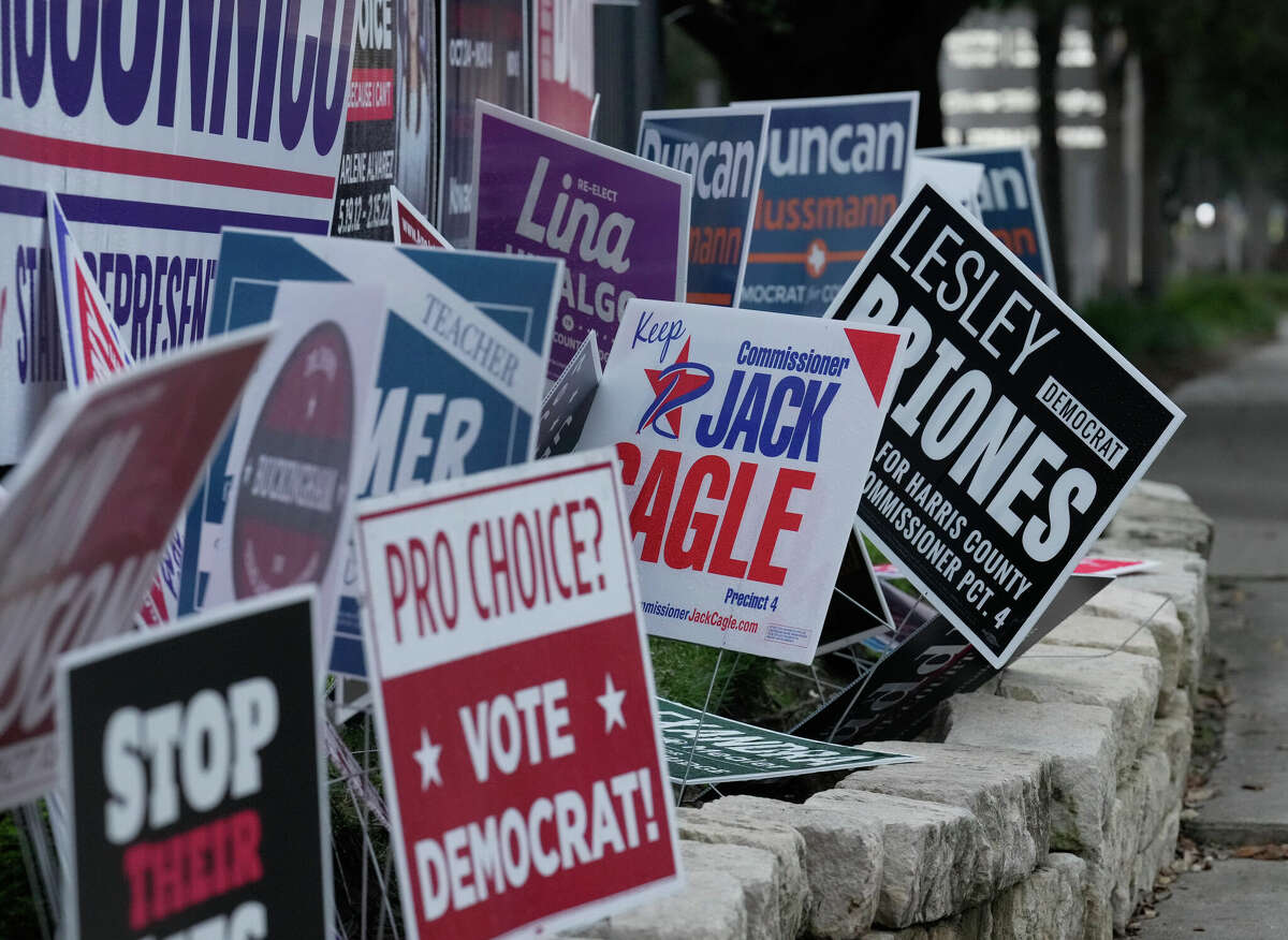 Election signs are seen from a polling location at La Quinta Inn & Suites by Wyndham Tuesday, Nov. 8, 2022, at Galleria in Houston.