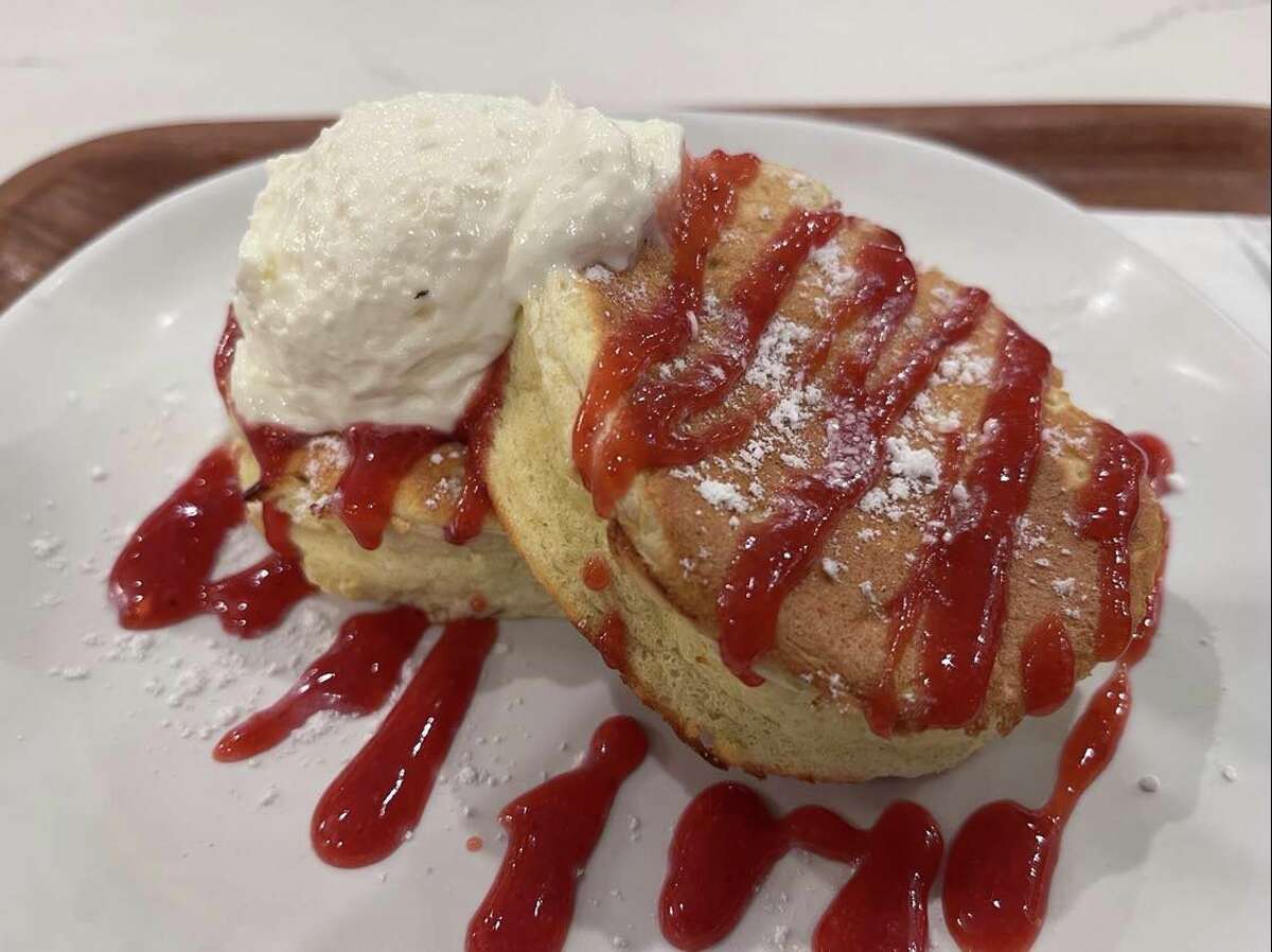 Grove Tea Lounge's souffle pancakes are sweet and hearty. Two thick, fluffy pancakes are drizzled in house-made strawberry puree and sweet cream. Another option is matcha cream.