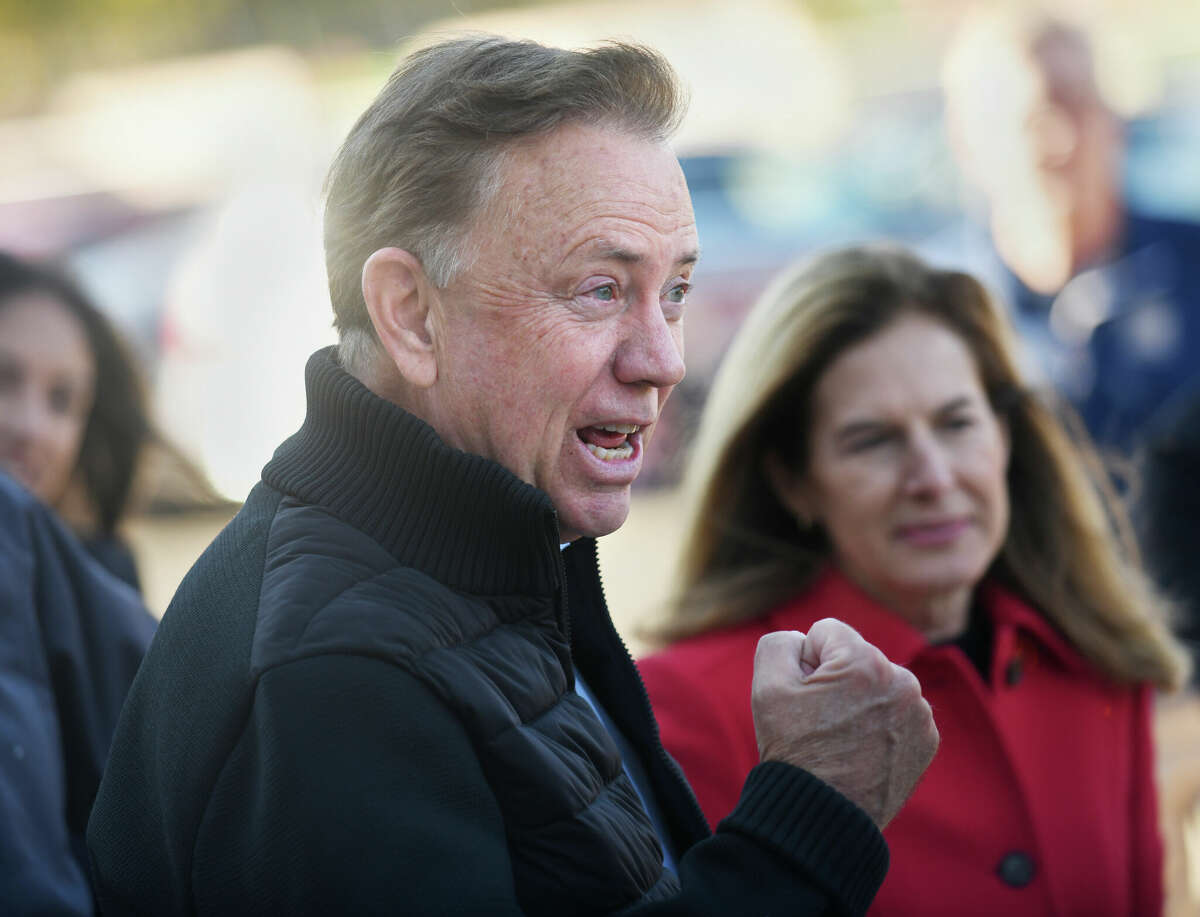 Connecticut Gov. Ned Lamont campaigns with fellow Democrats outside the District 7 polling center at Greenwich High School in Greenwich, Conn. on Election Day, Tuesday, Nov. 8, 2022.
