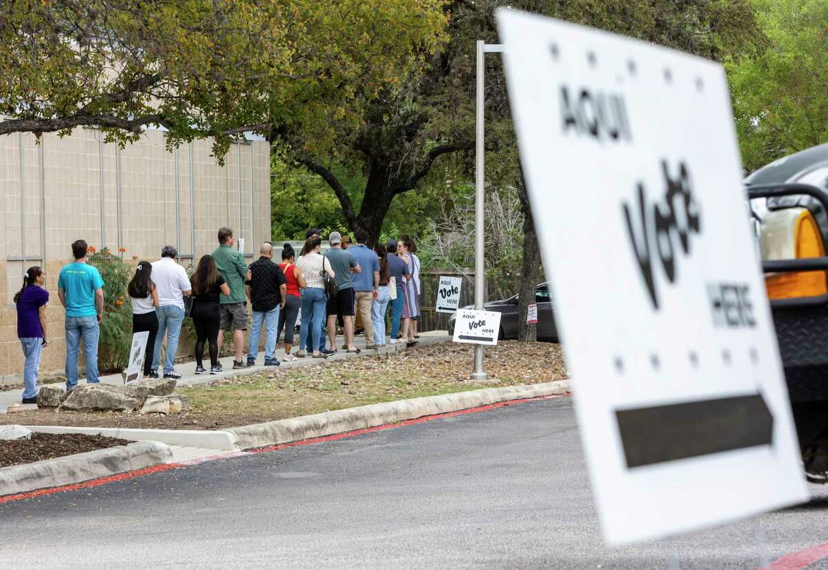 People wait to vote Tuesday, Nov. 8, 2022 at the Brook Hollow Branch Library during the midterm elections.