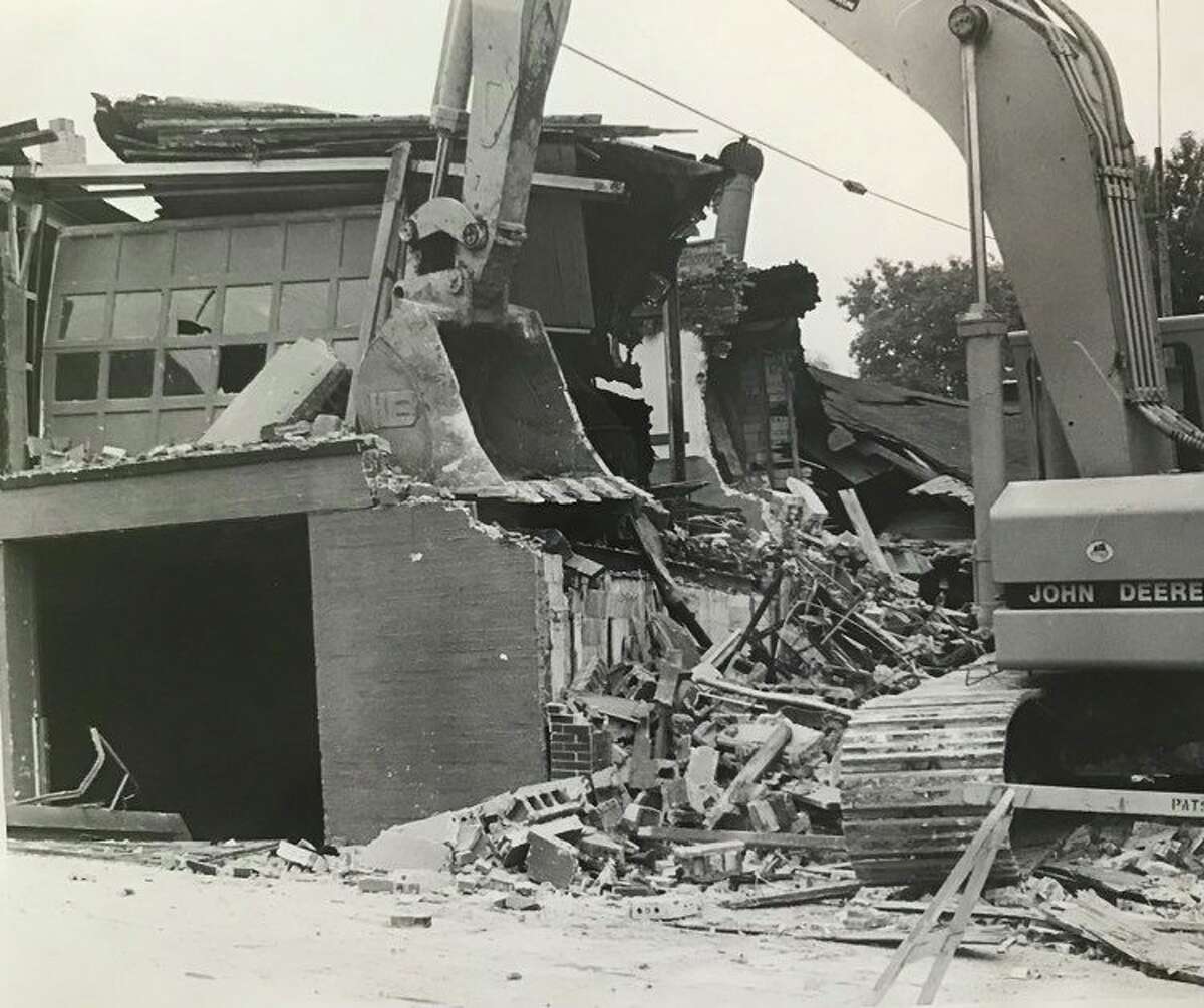 The former Baird Oil Co. building, located on East Main Street, is torn down as part of an office-retail structure project initiated by the East Main Street Redevelopment Partnership. June 1982