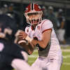 New Canaan's Ty Groff (8) looks downfield during a football game in Wilton on Friday, Oct. 21, 2022.