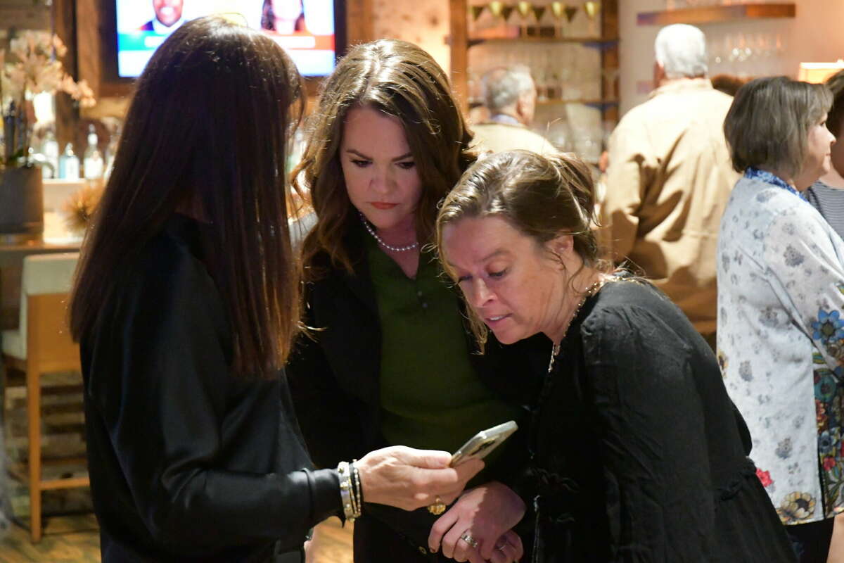 Midland mayor candidate Lori Blong talks with supporters on Election Night, Nov. 8, 2022 at Ally Outdoors. 