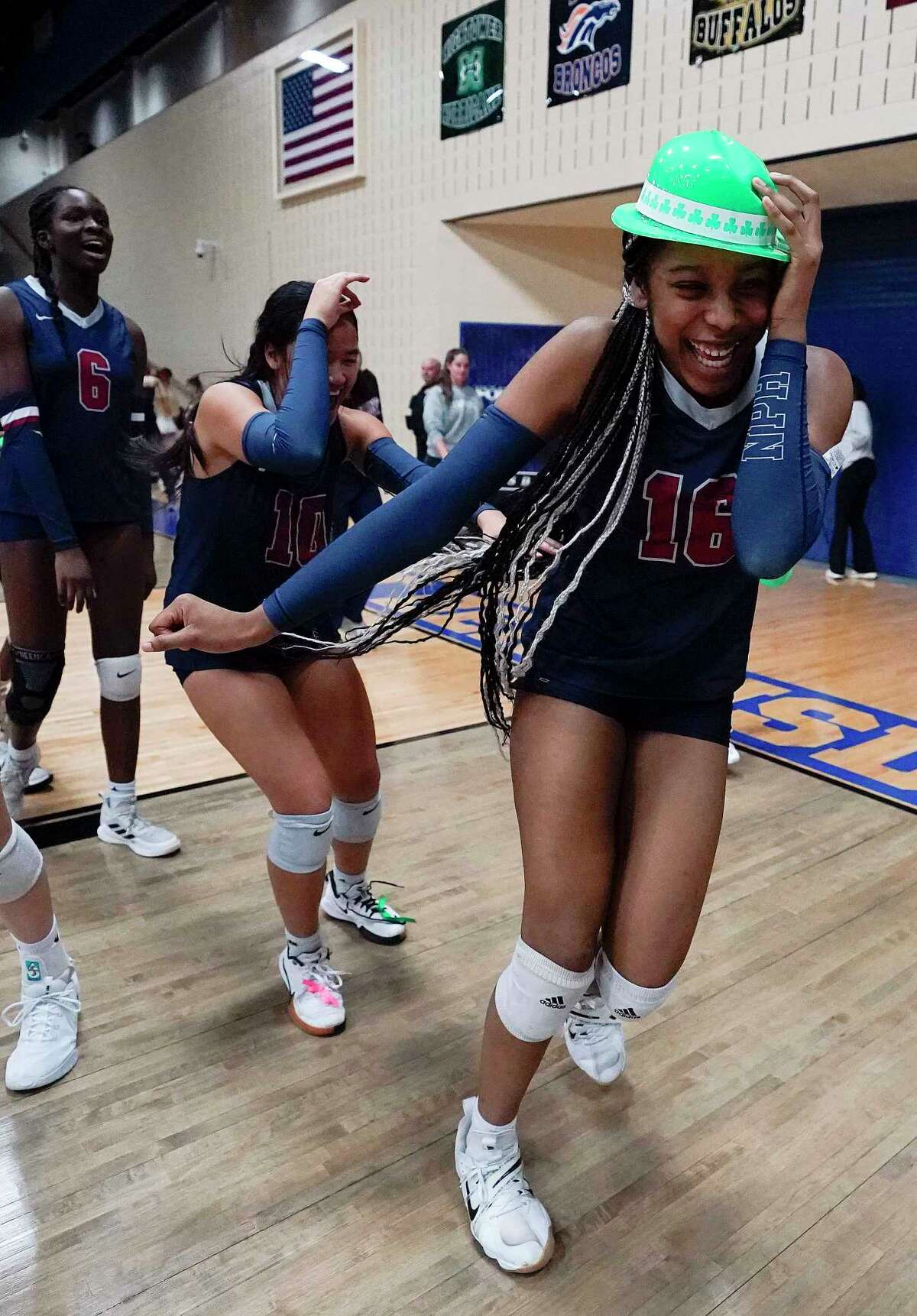 Tompkins' Angel Debekeme (16) celebrates the team’s win in a Region III-6A quarterfinal high school volleyball playoff match against Ridge Point, Tuesday, Nov. 8, 2022, in Sugar Land.