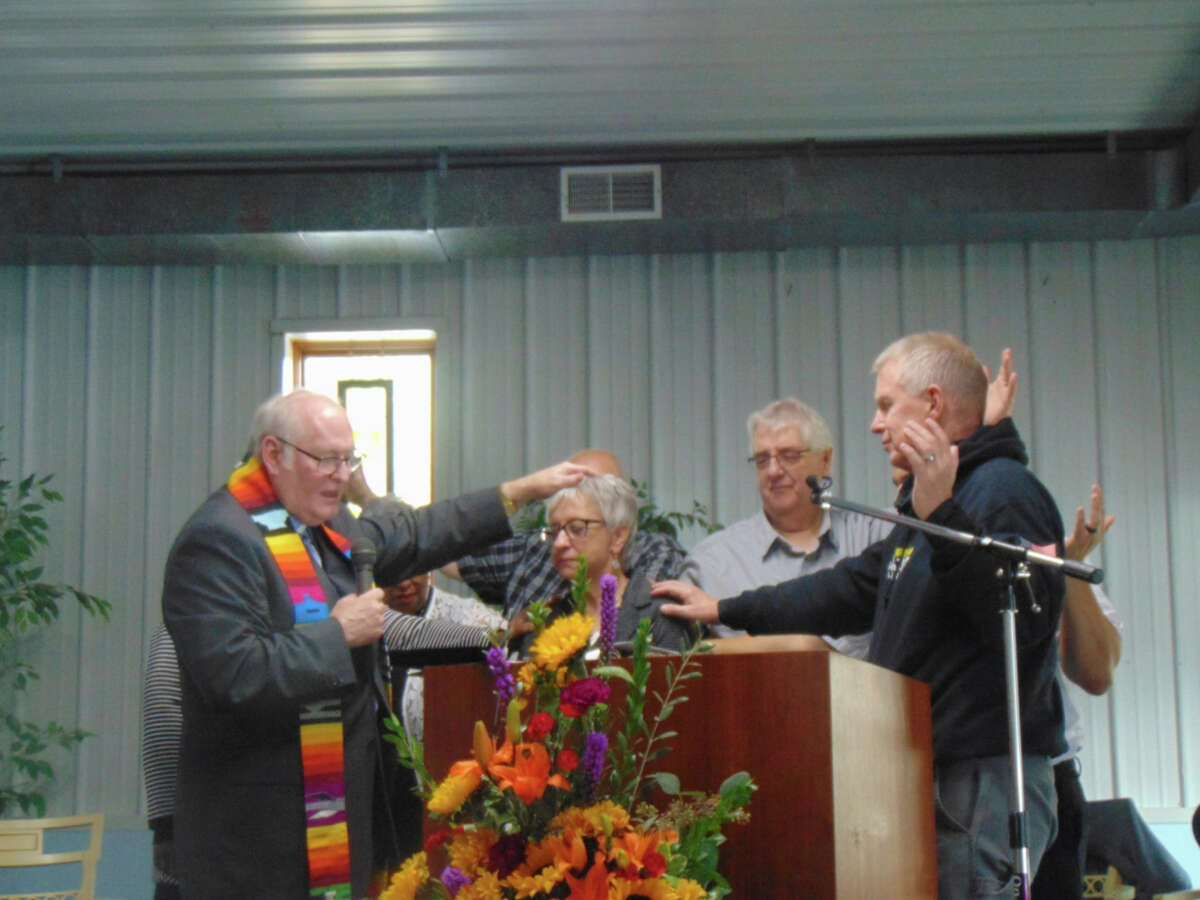 About 150 people from several different churches in Lake County joined together Sunday to dedicate the River Community Center. In apostolic succession, ministers formally induct Rev. Debbie Alley as center director.