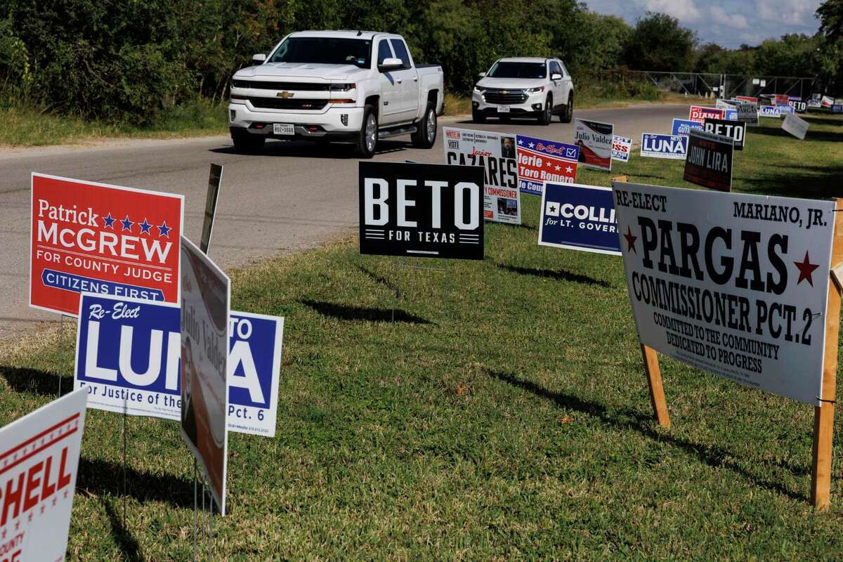 Campaign signs line the entrance to the Center For Community Wellness on South Evans Street in Uvalde, Texas, on Tuesday, Nov. 8, 2022.