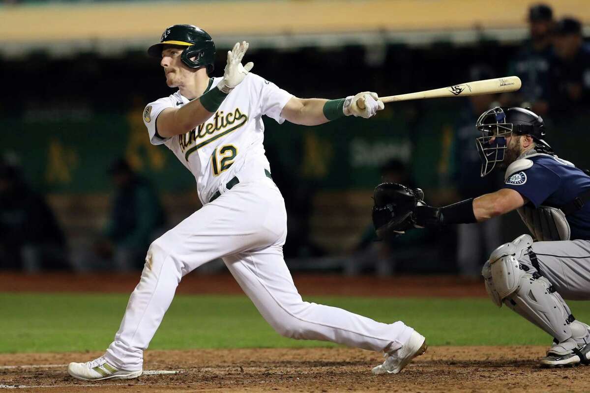 Oakland Athletics’ Sean Murphy hits an RBI double in 5th inning double against Seattle Mariners during MLB game at Oakland Coliseum in Oakland, Calif., on Tuesday, September 20, 2022.