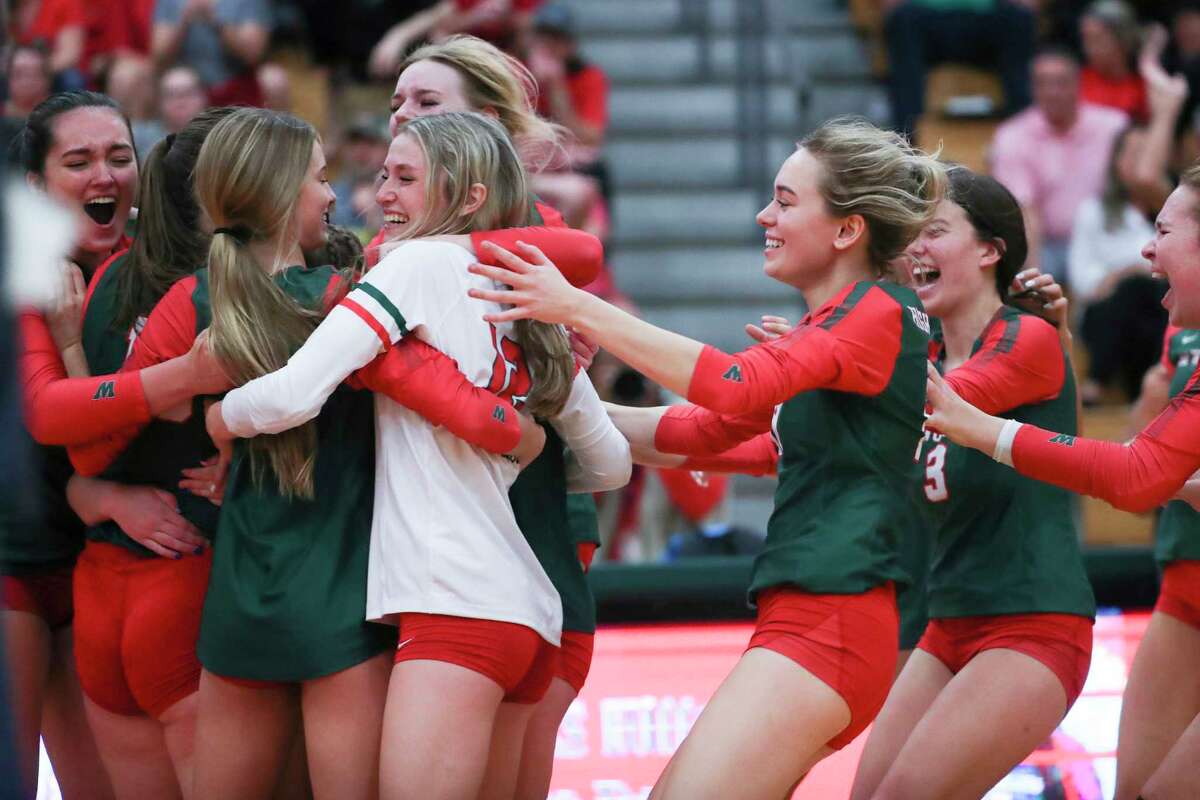 The Woodlands celebrates after defeating Tomball in five sets during a Region II-6A quarterfinal volleyball match at The Woodlands High School, Tuesday, Nov. 8, 2022, in The Woodlands.