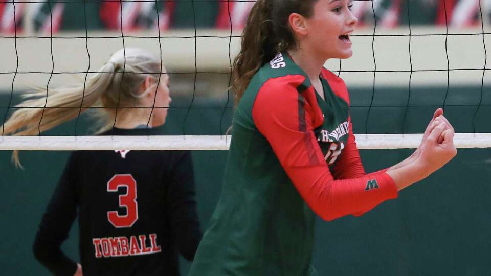 The Woodlands outside hitter Ella Lewis (14) reacts after scoring a point in the first set during a Region II-6A quarterfinal volleyball match at The Woodlands High School, Tuesday, Nov. 8, 2022, in The Woodlands.