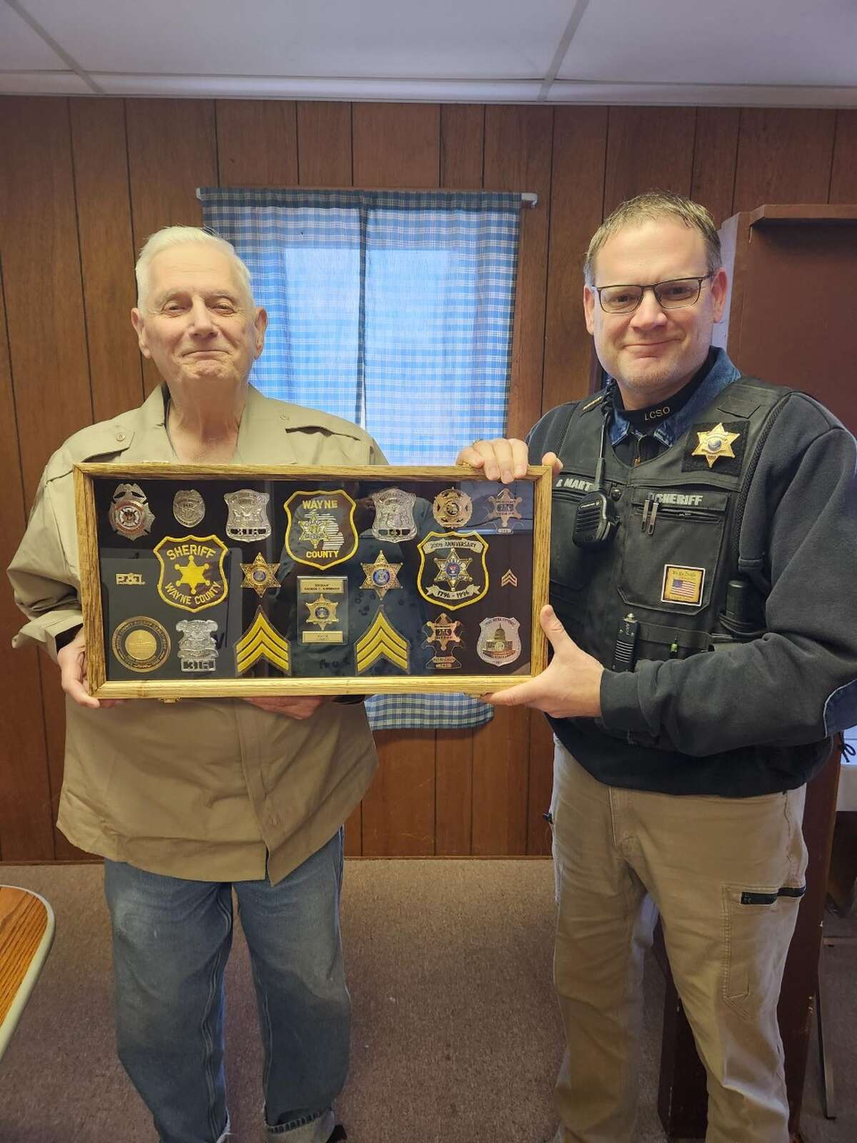 Cherry Valley Township supervisor George Supernois (left) was honored for his service to his community and his country with the presentation of a retirement shadowbox by Lake County Sheriff Rich Martin (right) recently.