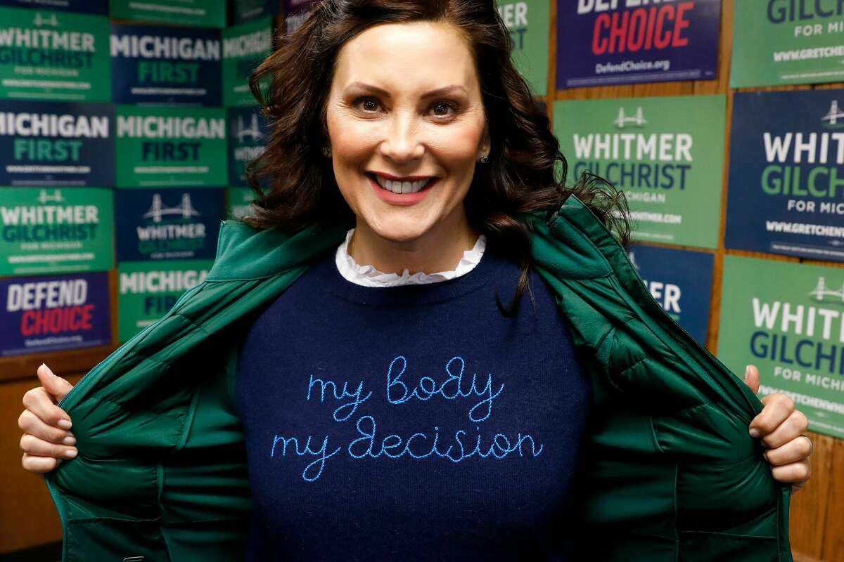 Michigan State Governor Gretchen Whitmer shows a "My Body My Decision" shirt at the 14th District Democratic Headquarters, during the US midterm election in Detroit, Michigan, on Nov. 8, 2022.