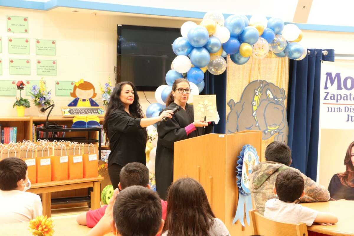 Judge Monica Notzon distributed “Be Grateful” bags to students at J.C. Martin Elementary School as part of the 111th District Court staff's annual giveaway program.