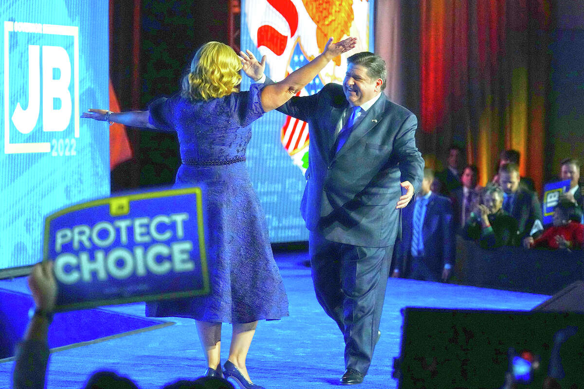 Gov. J.B. Pritzker hugs his wife, M.K., after Pritzker defeated GOP challenger Darren Bailey.