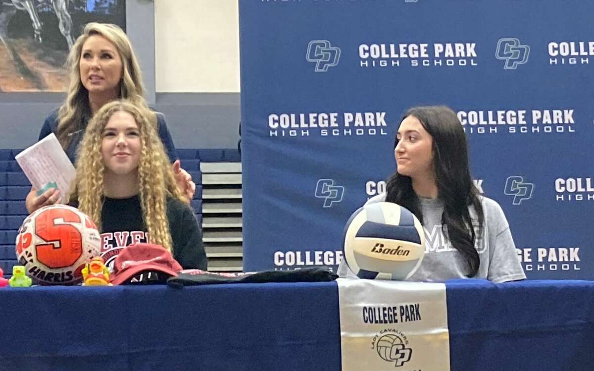 College Park volleyball coach Candice Gibson speaks about Molly Harris, left, as Peyton Sedlacek looks on during a signing day ceremony, Wednesday Nov. 9, 2022 in The Woodlands.
