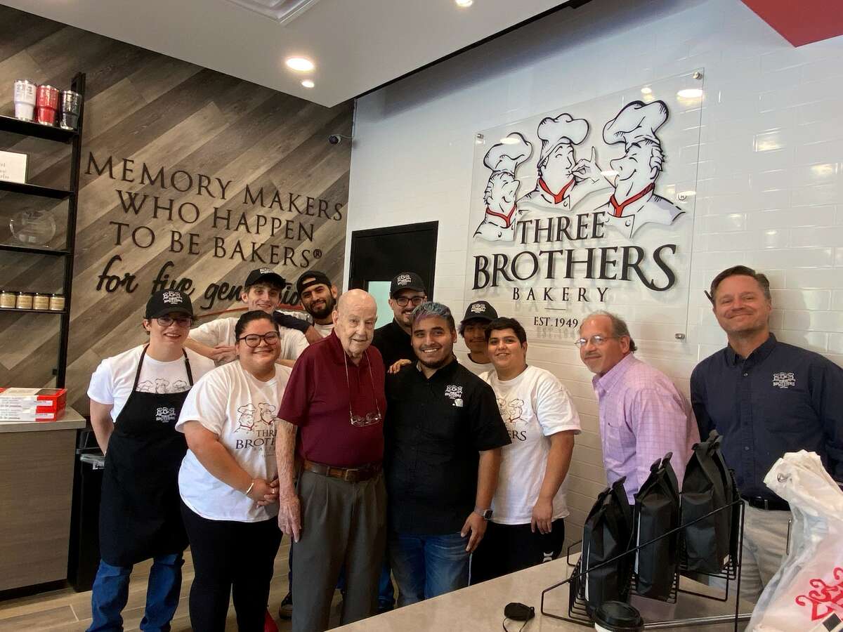 Clyde Cannon, the first customer of Three Brothers Bakery and the new Tanglewood location, poses for a photo with the team at Tanglewood.